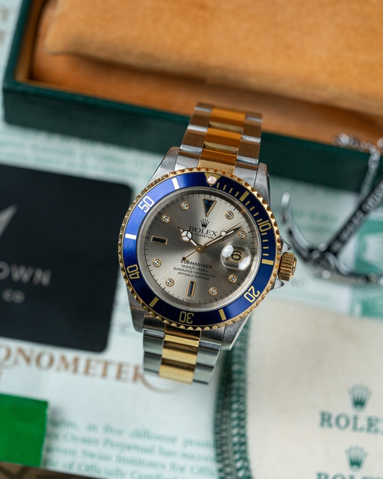 Two Tone Yellow Gold Rolex Submariner 16613 Serti Dial Watch at Alpha Crown Luxury Watches