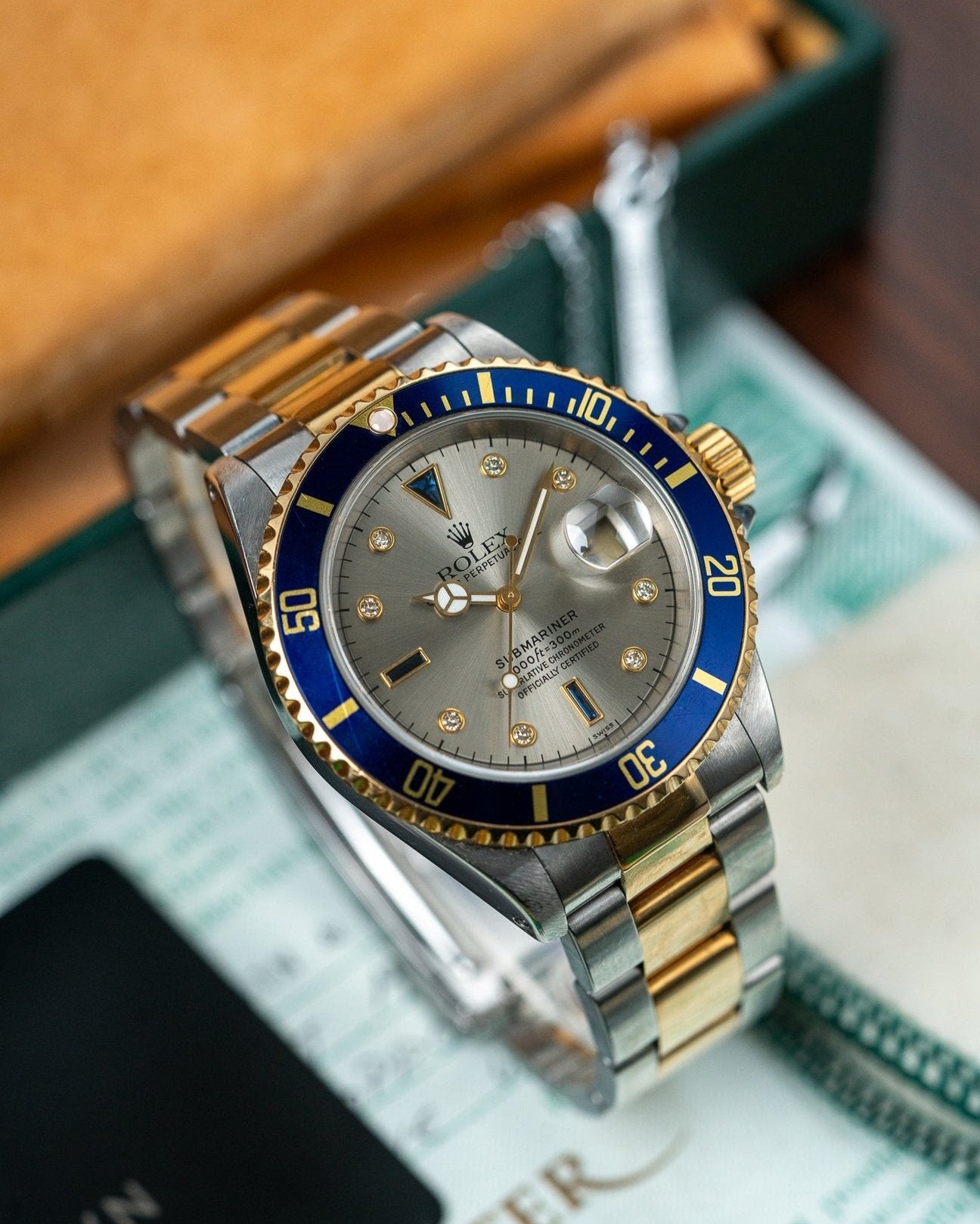 Two Tone Yellow Gold Rolex Submariner 16613 Serti Dial Watch at Alpha Crown Luxury Watches