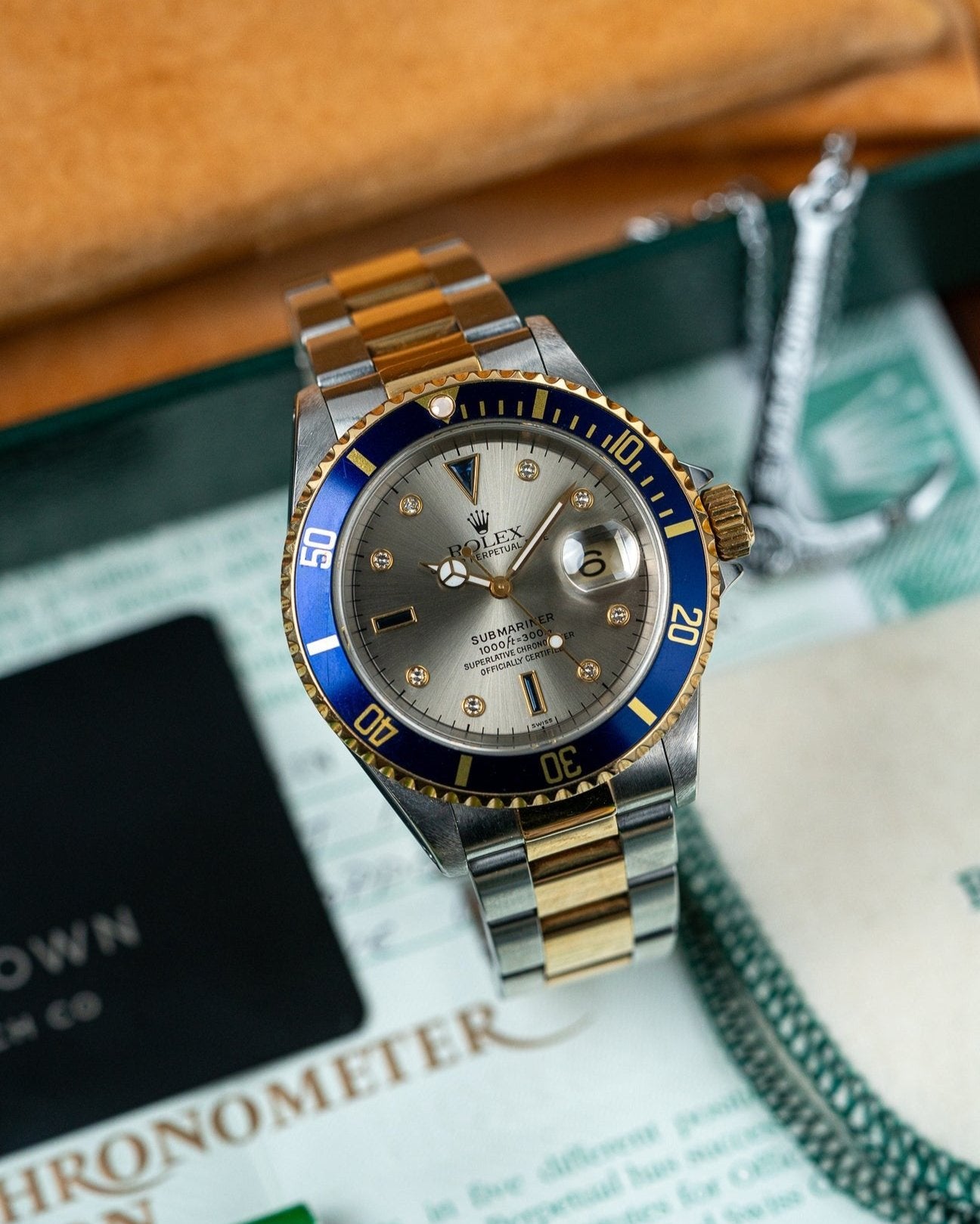 Two Tone Yellow Gold Rolex Submariner 16613 Serti Dial Watch at Alpha Crown Luxury Watches