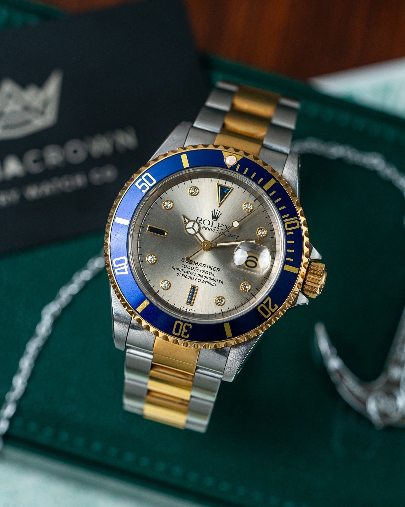 Two Tone Yellow Gold Rolex Submariner 16613 Serti Dial Watch at Alpha Crown Luxury Watches